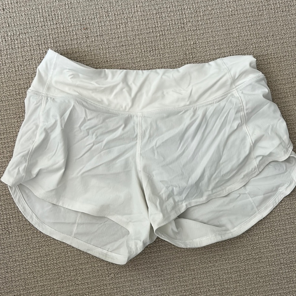 Speed up mid rise 4 inch white shorts. Size 6 and good condition.